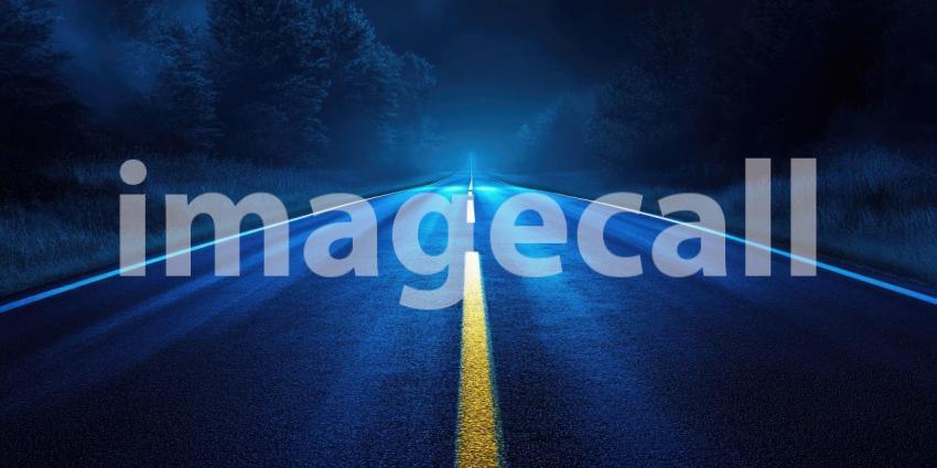 Surreal Night Road: An Illuminated Straight Road with a Yellow Dashed Center Line and White Edge Lines