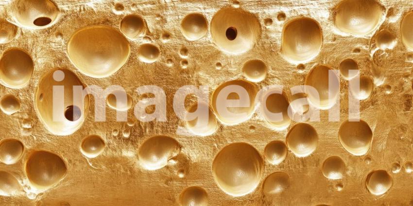 Close-up Macro of a Swiss Cheese Slice, Revealing its Intricate Network of Air Bubbles and Golden Yellow Texture