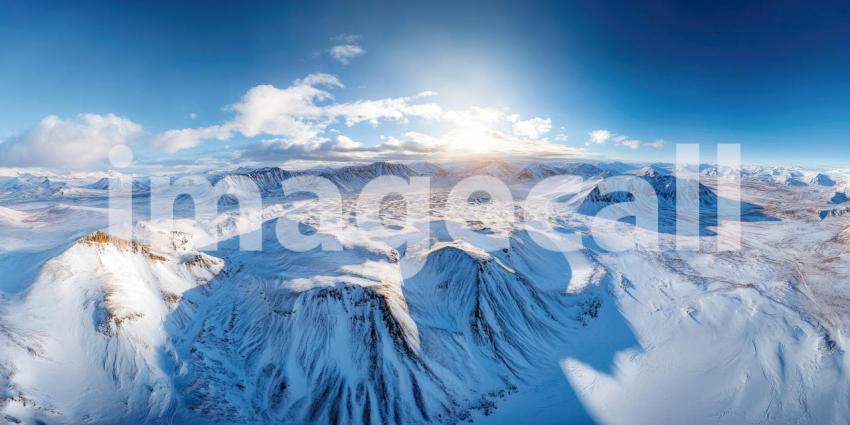 Winter Wonderland: A Breathtaking Panorama of Snow-Dusted Mountains and Evergreen Forests Beneath a Clear Blue Sky