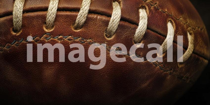 A Touch of History: A Close-Up of a Well-Worn Leather Football, Its Stitching and Grain Telling Stories of Past Games and Gritty Glory