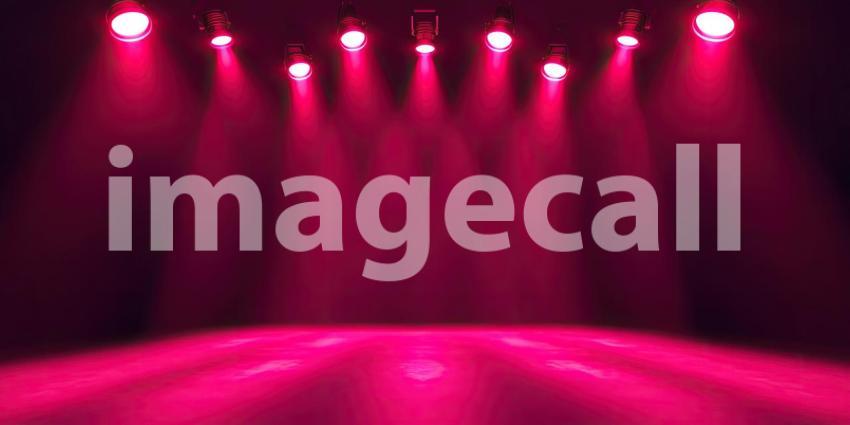 Spotlight on Stage: A Dramatic Scene Illuminated by Crimson Beams