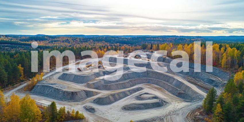 Heavy machinery carves its way through the rugged mountain terrain, extracting resources from the earth