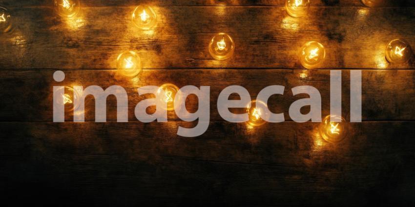 Glowing Bulb Array: Warm Lights on Rustic Wood, a Pattern of Vintage Illumination on a Textured Backdrop.