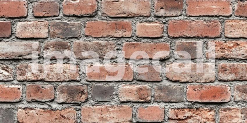 Aged Brick Wall Texture: Varied Colors and Weathered Surfaces, Close-Up of Rustic Construction Material in a Patterned, Time-Worn Detail.