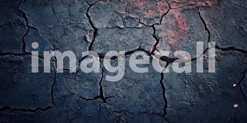 Dark Grunge Textured Wall with Subtle Cracks, Rough and Moody Background Design