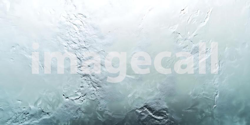 Water Runs Down a Glass Surface Distorting the View in an Abstract Dance of Light and Texture