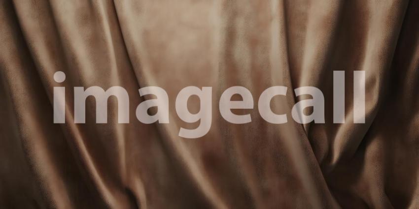 Soft Waves of Rich Brown Fabric Flow Gently Creating a Luxurious and Smooth Texture