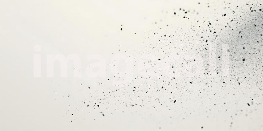 Scattered Black Particles Dance Lightly Across a Clean White Surface Creating a Subtle Texture