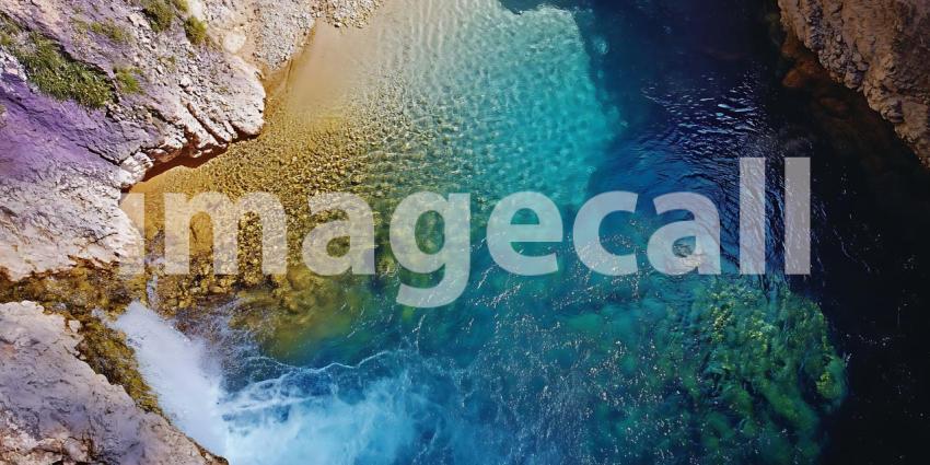 Vibrant Coastal Waters Aerial View of Turquoise Ocean and Rocky