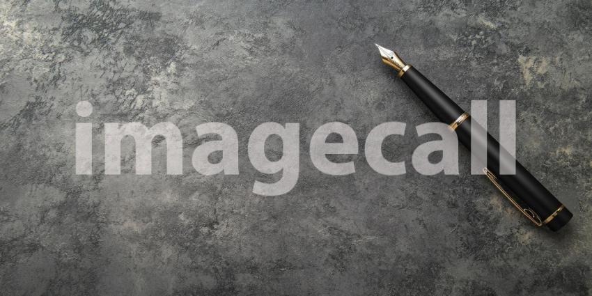 A Writer's Instrument - A sleek fountain pen rests gracefully on a textured surface, poised and ready to capture thoughts and ideas on paper