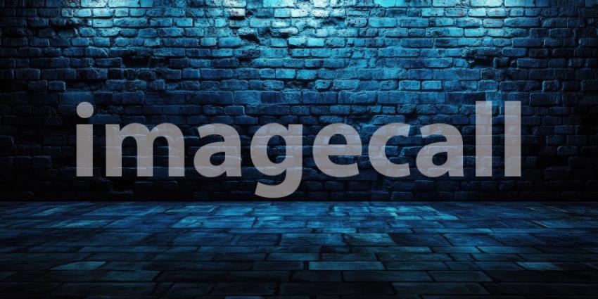 Spotlight on Brick: A beam of light pierces the darkness, illuminating a textured brick wall with a dramatic spotlight effect