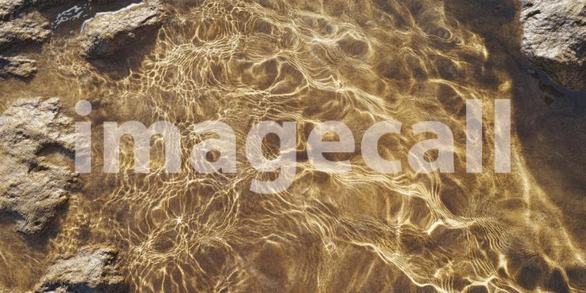 A Tapestry of Time: A weathered stone surface, etched with years of wear and tear, reveals a mesmerizing interplay of textures and shades, capturing the essence of history and resilience