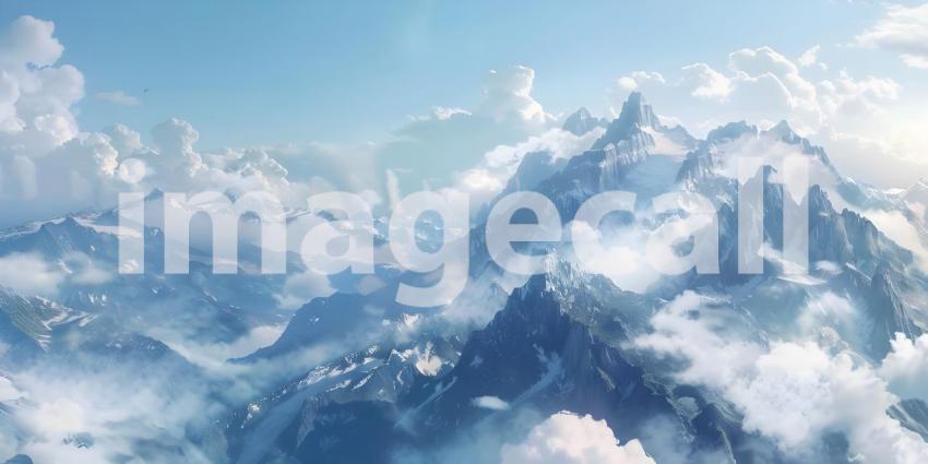 Aerial View of a Mountain Range: A Breathtaking Panorama of Snow-Covered Peaks and Clouds
